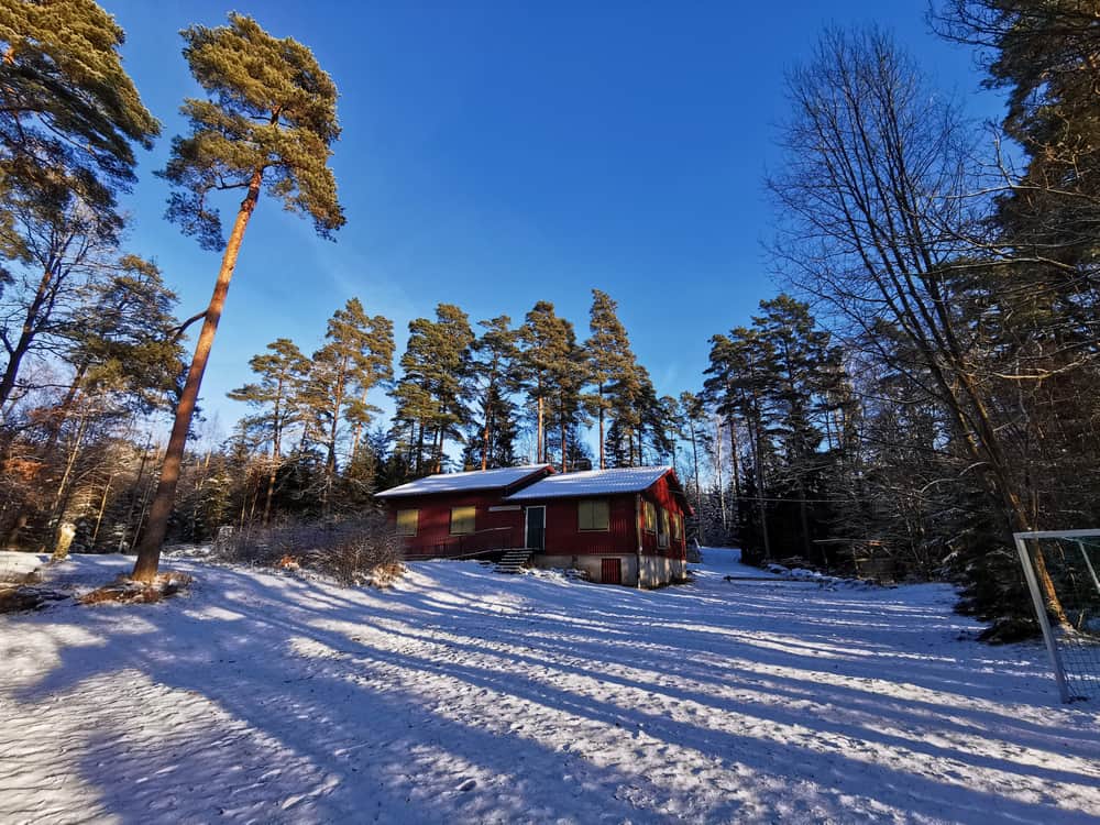 Beautiful winter landscape by the cabin