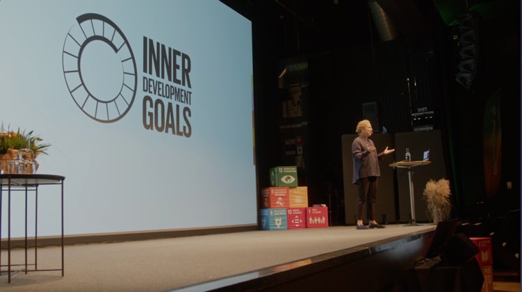 Gabriella Grusell on stage presenting her keynote about the Inner Development Goals